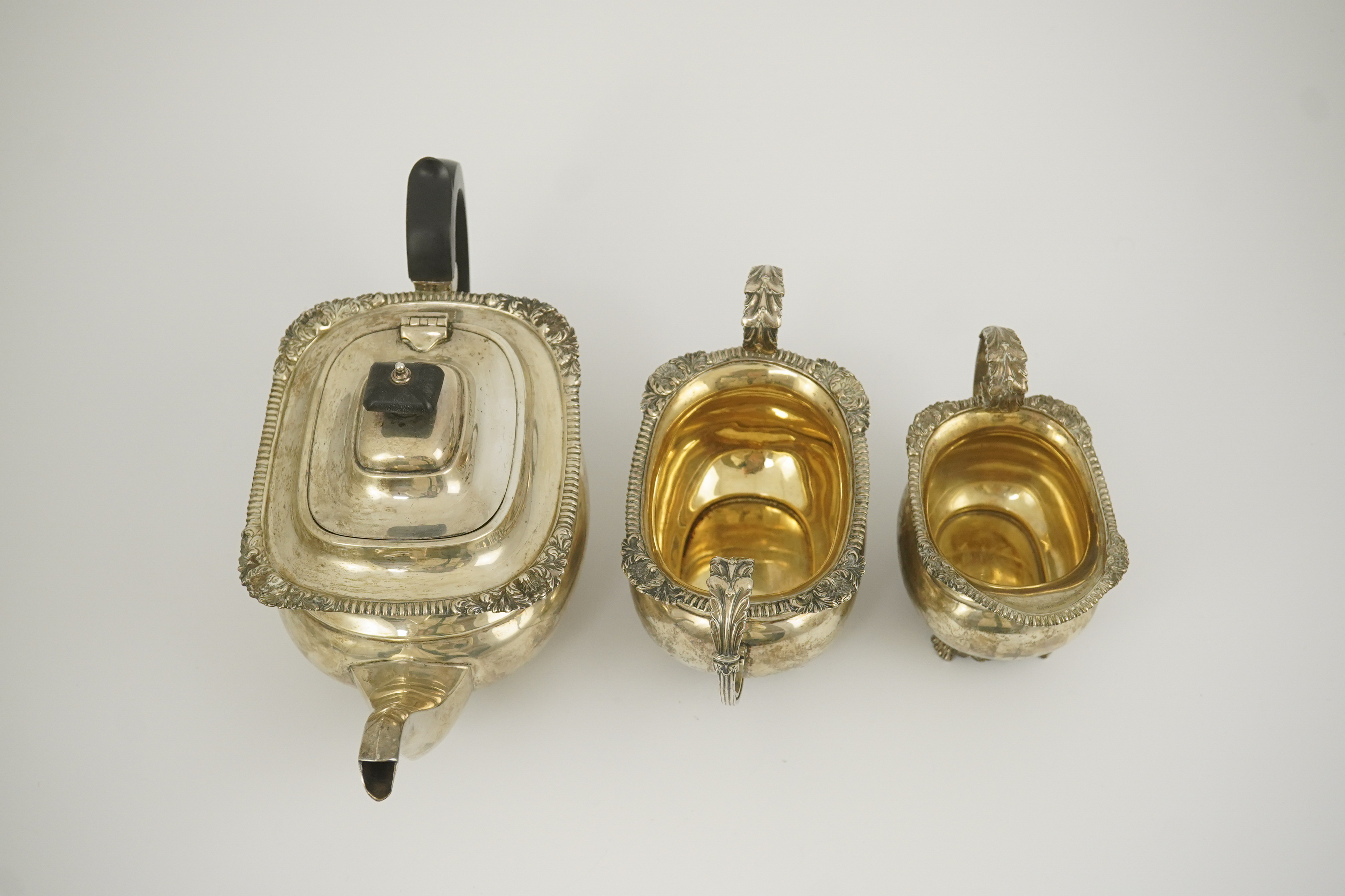 A George V silver three piece tea set by Edward Barnard & Sons Ltd